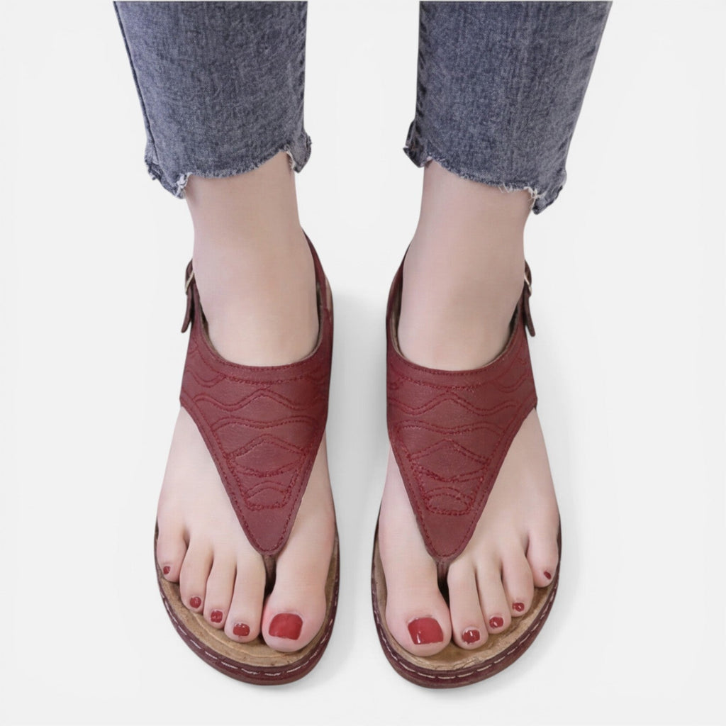 Women’s red wedge sandals, back view with adjustable buckle closure