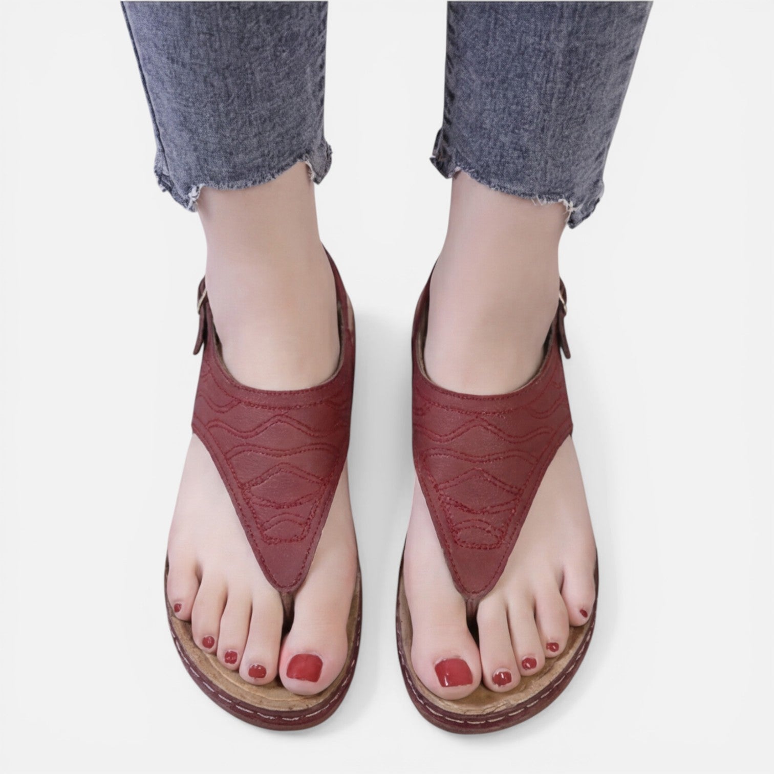 Women’s red wedge sandals, back view with adjustable buckle closure
