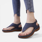 Women’s navy wedge sandals with cutout upper and open-toe thong strap