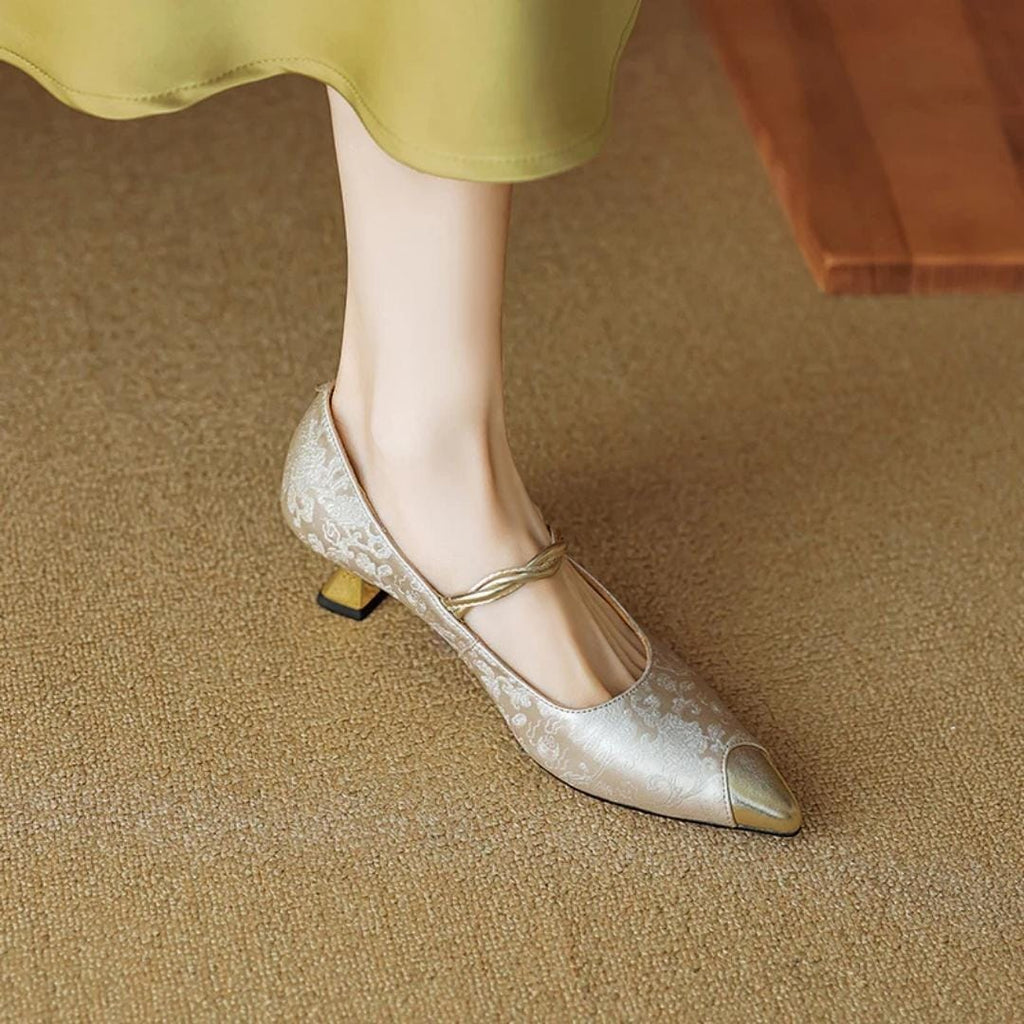 Metallic pointed kitten heels with pearl strap and gold buckle, low block heel