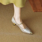 Metallic pointed kitten heels with pearl strap and gold buckle, low block heel