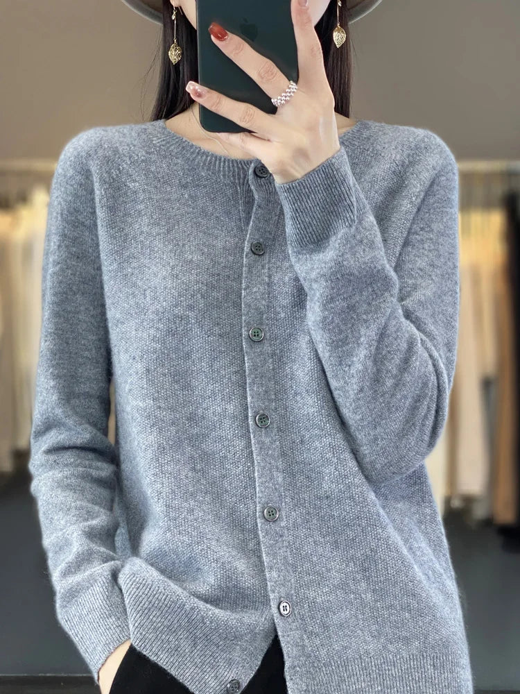 Women’s cardigan sweater, button-front knit, long sleeves, heather grey knit.