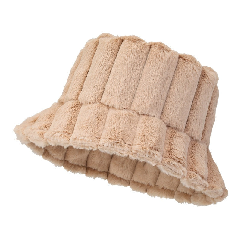 Beige plush bucket hat with quilted vertical panels and wide frilled brim
