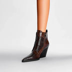 Women’s pointed-toe ankle boots in brown with buckle strap detail