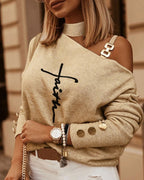Beige knit sweater with graphic script print and asymmetric neckline