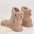 Beige women’s ankle boots pair with side zipper, fuzzy cuff, and platform tread sole