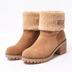 Women’s mid-calf winter boots in tan suede with tan shearling cuff and small brown patch