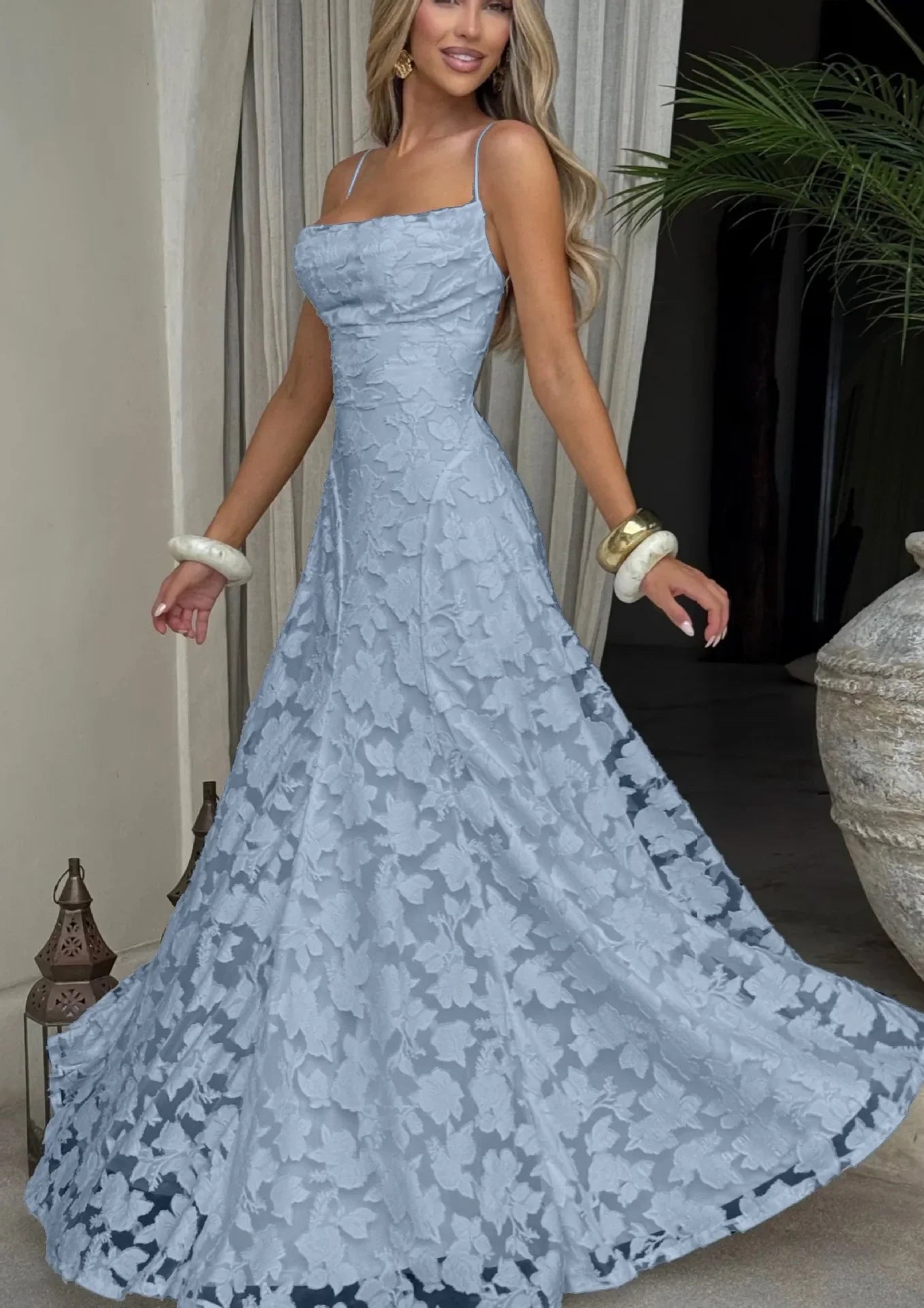 Light blue maxi evening dress with spaghetti straps, fitted bodice, lace A-line skirt