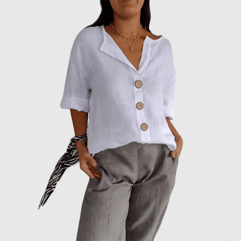 White V-neck button-front blouse with short sleeves and round wooden buttons