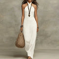 White halter linen maxi dress, sleeveless with fitted bodice and wide draped skirt