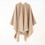 Beige cashmere poncho with V-neck, draped sleeves, fringe hem