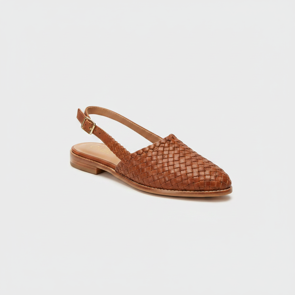 Woven pointed-toe flat sandals in tan brown with ankle strap and low heel