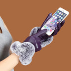Purple leather gloves with gray faux fur cuffs and a smooth, fitted hand shape.