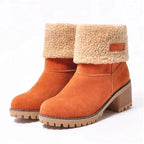 Women’s mid-calf winter boots in orange suede with tan shearling cuff and small logo patch