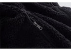 Black sherpa sleeveless bodywarmer with front zipper and metal zipper pull