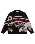 Black sweater with large front graphic in white and red and long sleeves