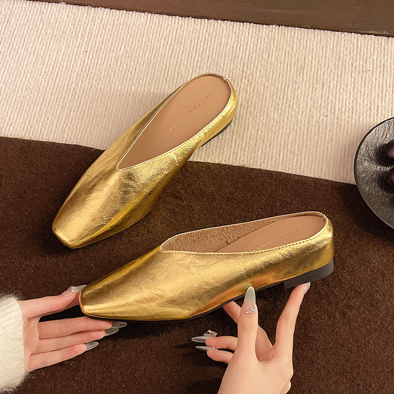 Gold slip-on flats with almond toe and supportive sole