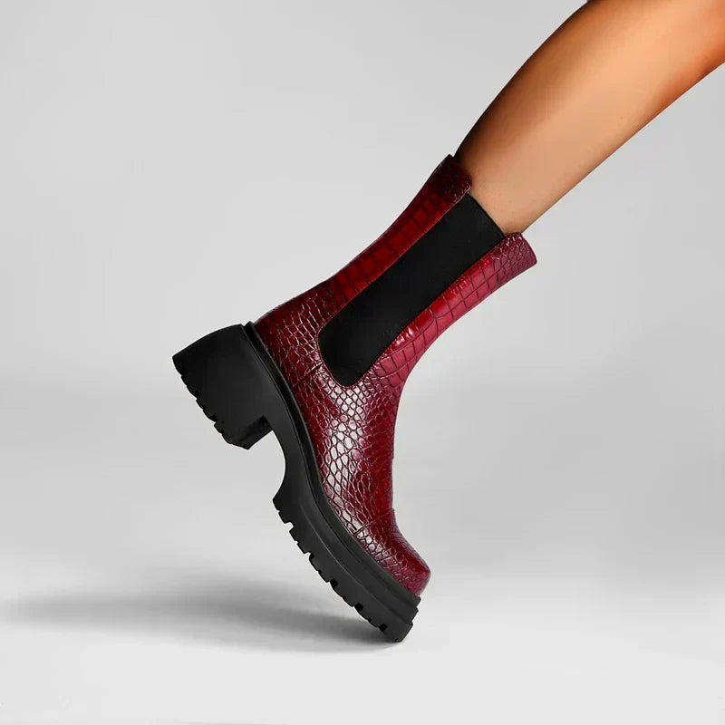 Dark red platform ankle boots with black elastic side panels and rugged lug sole