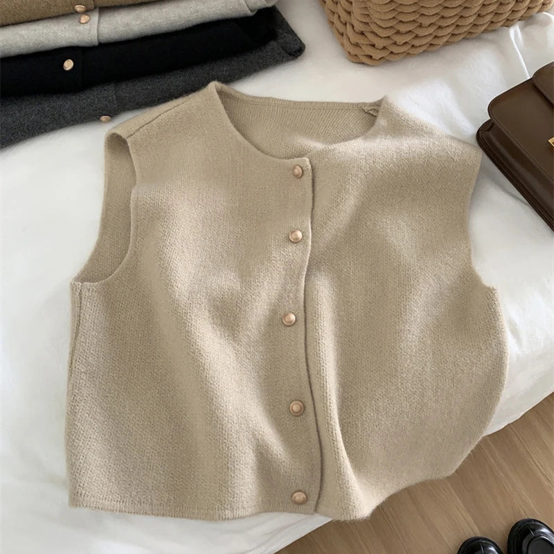 Light beige merino wool women’s sleeveless vest with four-button front