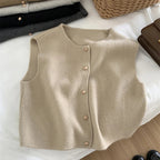 Light beige merino wool women’s sleeveless vest with four-button front