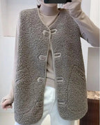 Gray wool-blend sherpa gilet with V-neck, sleeveless button front and flap pockets