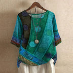 Women’s blouse in teal and blue with circular print, short sleeves, button front