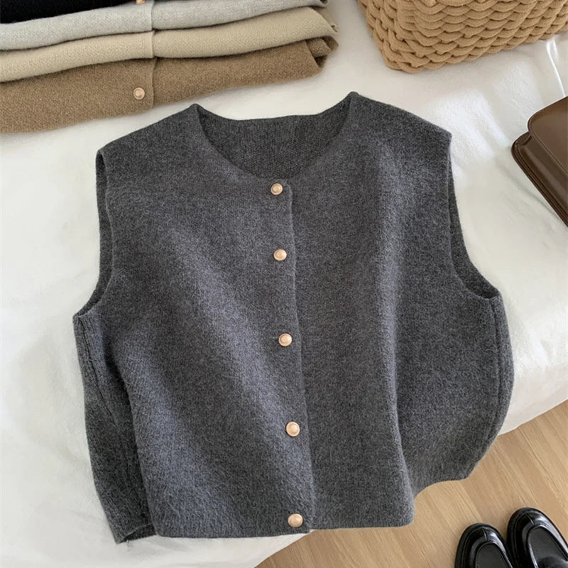 Dark gray merino wool women’s sleeveless vest with button-front placket