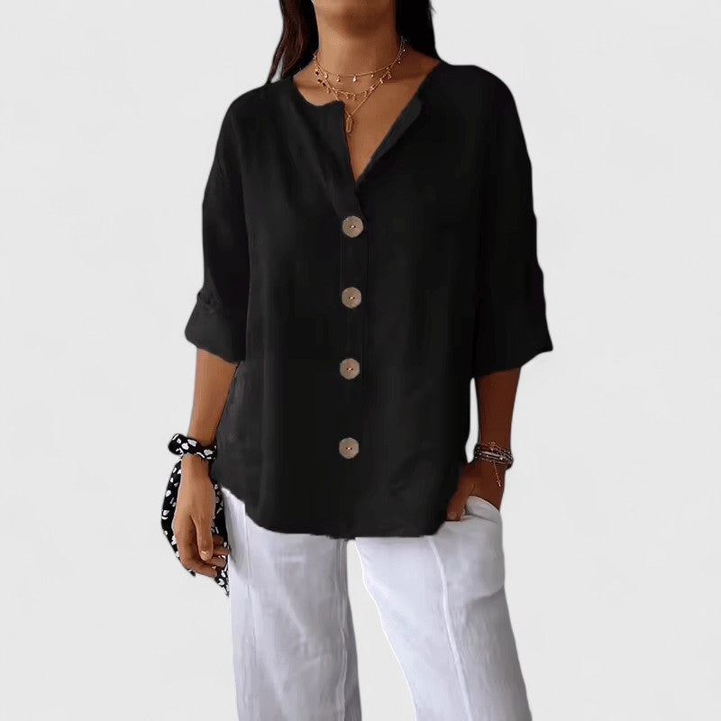Black V-neck button-front blouse with short sleeves and round wooden buttons