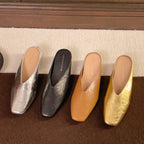 Women's slip-on flats with supportive sole in silver, black, brown, and gold