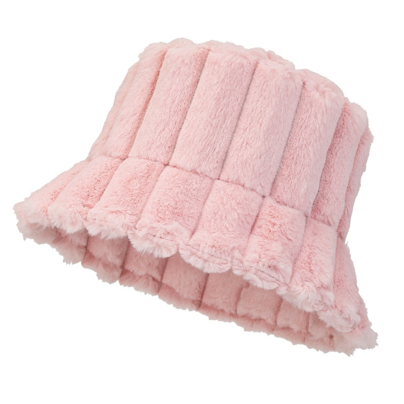 Light pink plush bucket hat with vertical quilted panels and wide frilled brim