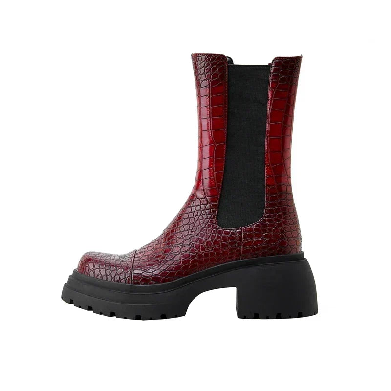 Dark red platform boots with black elastic side panels and textured leather-look finish
