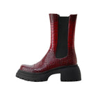 Dark red platform boots with black elastic side panels and textured leather-look finish