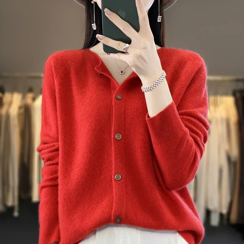 Women’s cardigan sweater, button-front knit, long sleeves, red knit with front buttons.