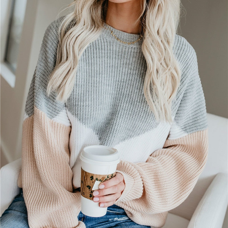 Women’s winter sweater with gray knit body, white chevron panel, tan bell sleeves