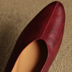 Wine red leather slingback flat upper with pointed toe and curved topline