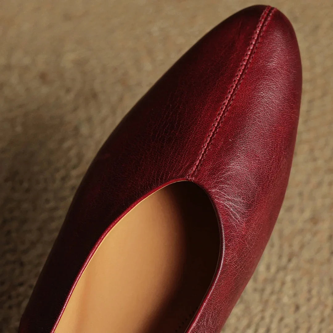 Wine red leather slingback flat upper with pointed toe and curved topline