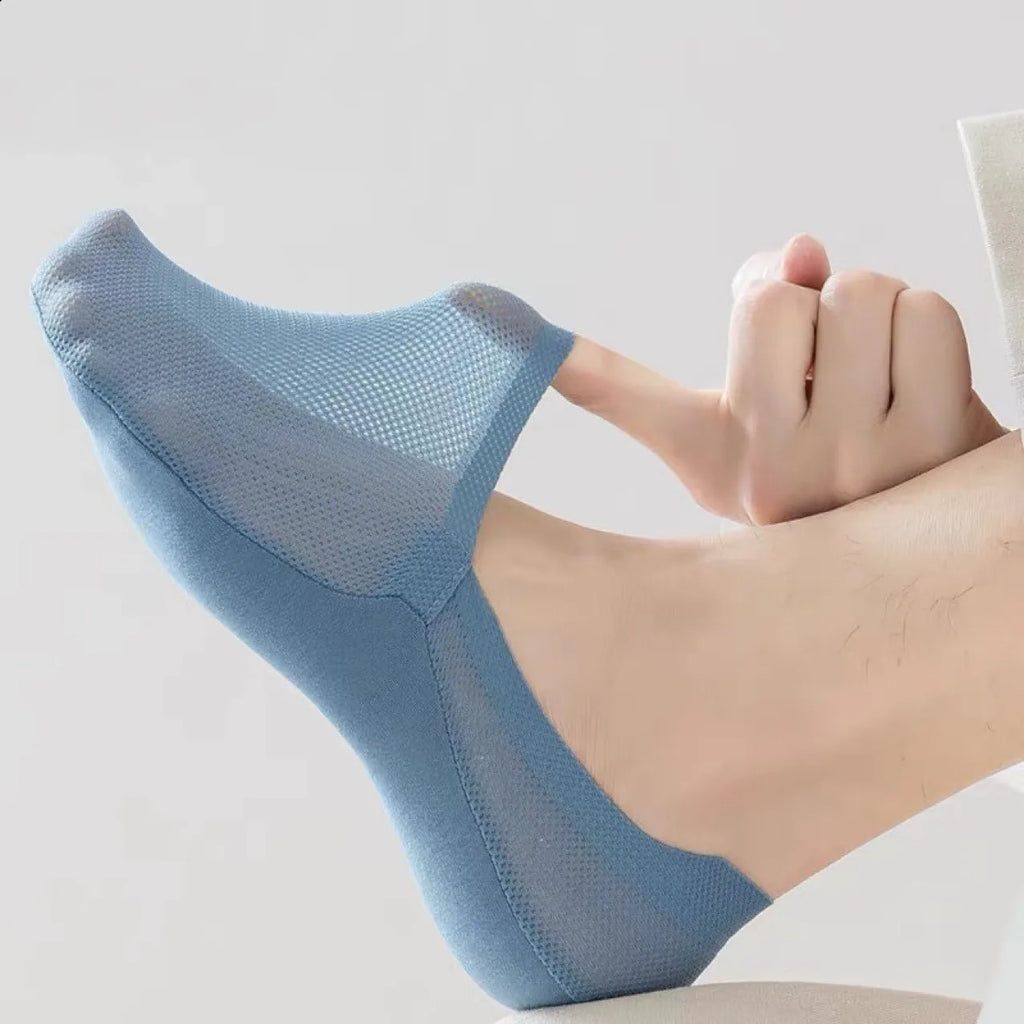 Blue no-show socks on foot, stretchy sheer knit