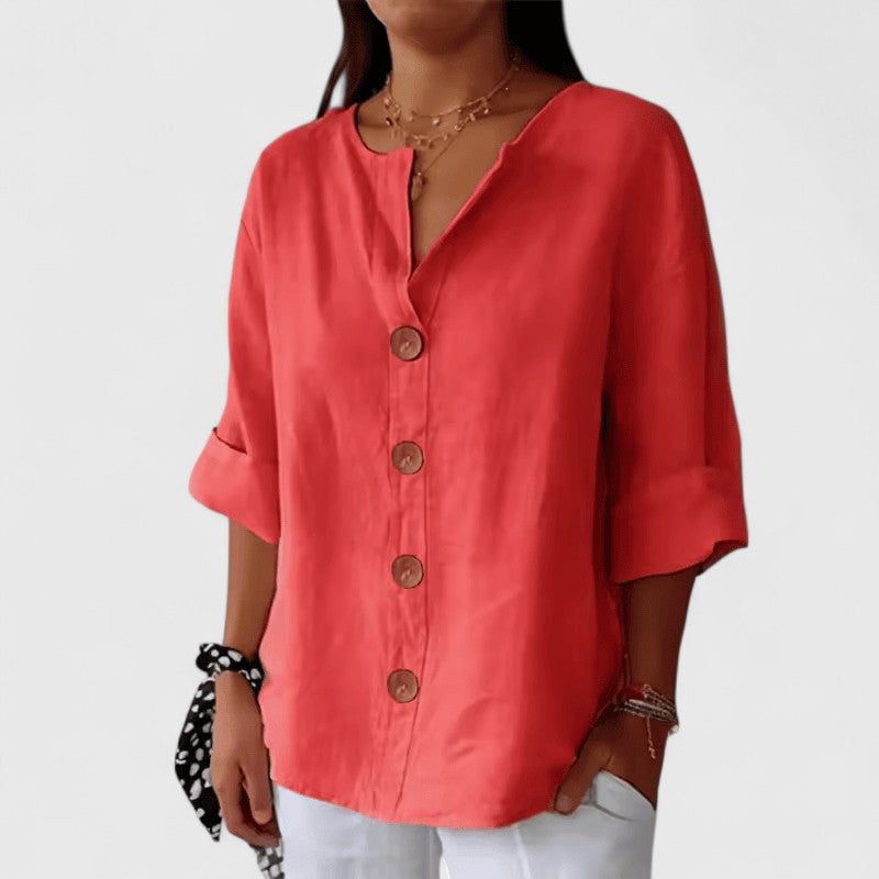 Red V-neck button-front blouse with elbow-length sleeves and round wooden buttons