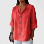 Red V-neck button-front blouse with elbow-length sleeves and round wooden buttons