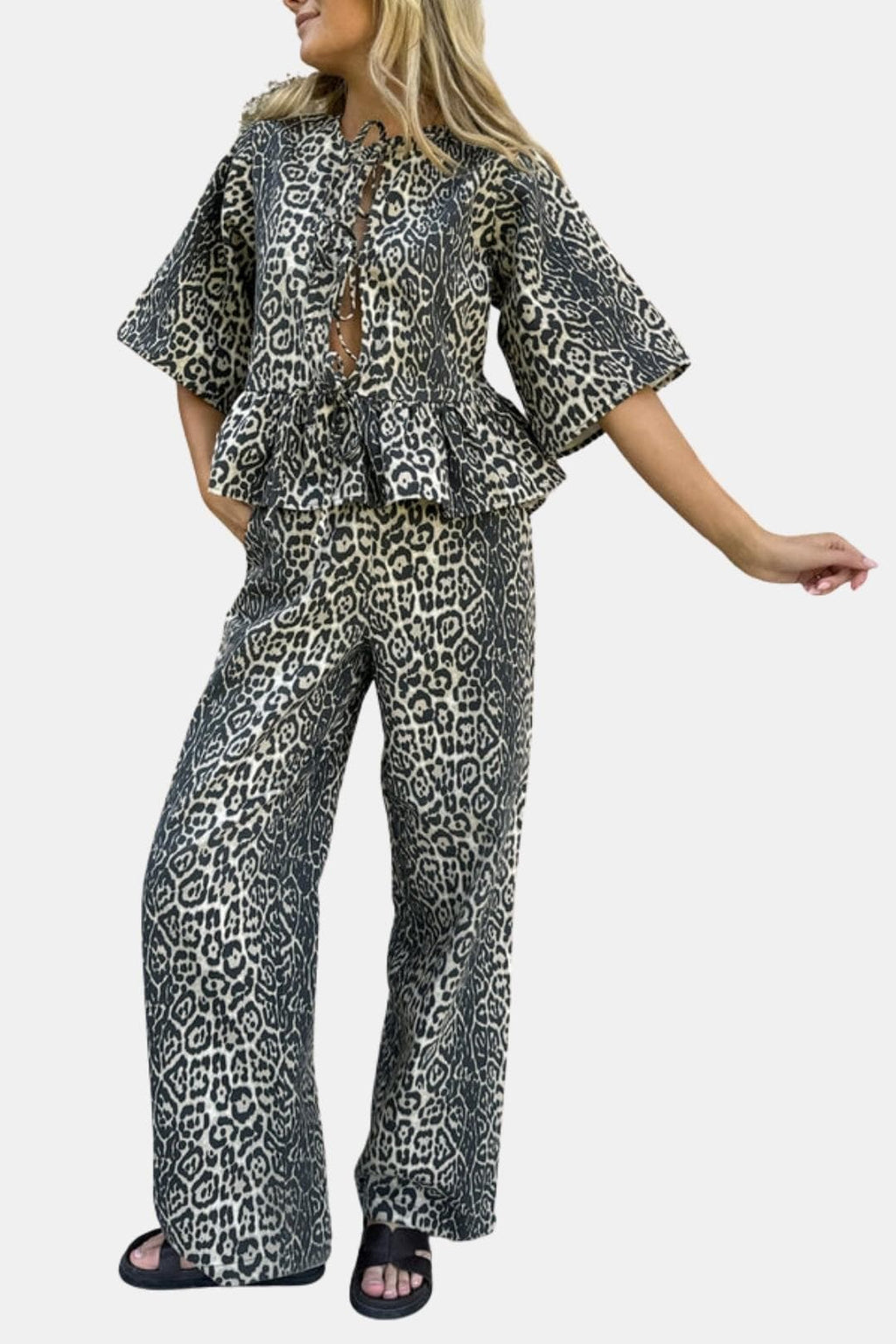 Leopard-print relaxed straight-leg trousers with wide bell silhouette