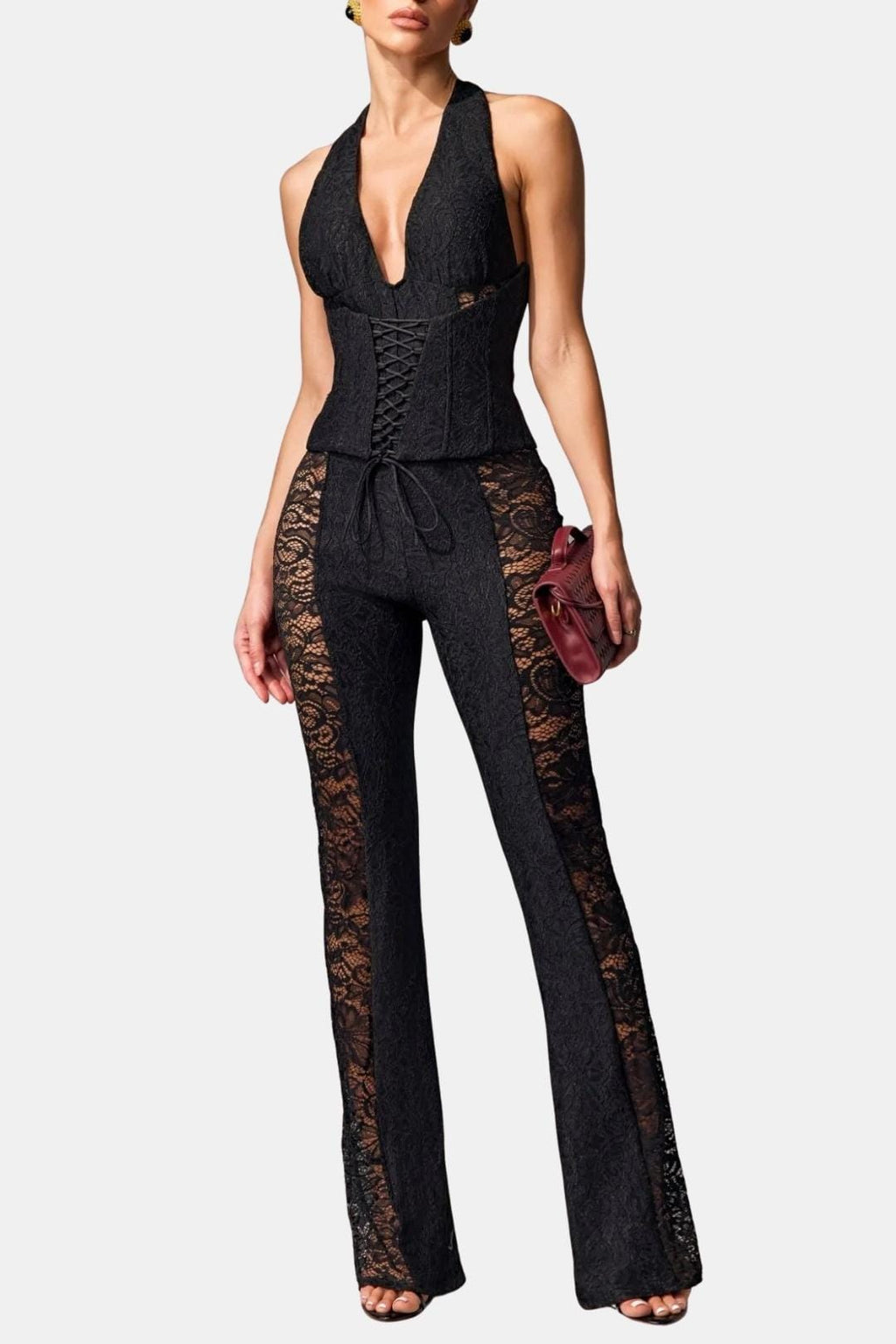 Black halter lace jumpsuit with corset seams, open V neckline, wide bell legs