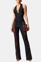 Black halter lace jumpsuit with corset seams, open V neckline, wide bell legs