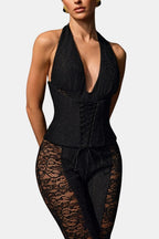 Black halter lace corset-style jumpsuit with plunging neckline and tie waist
