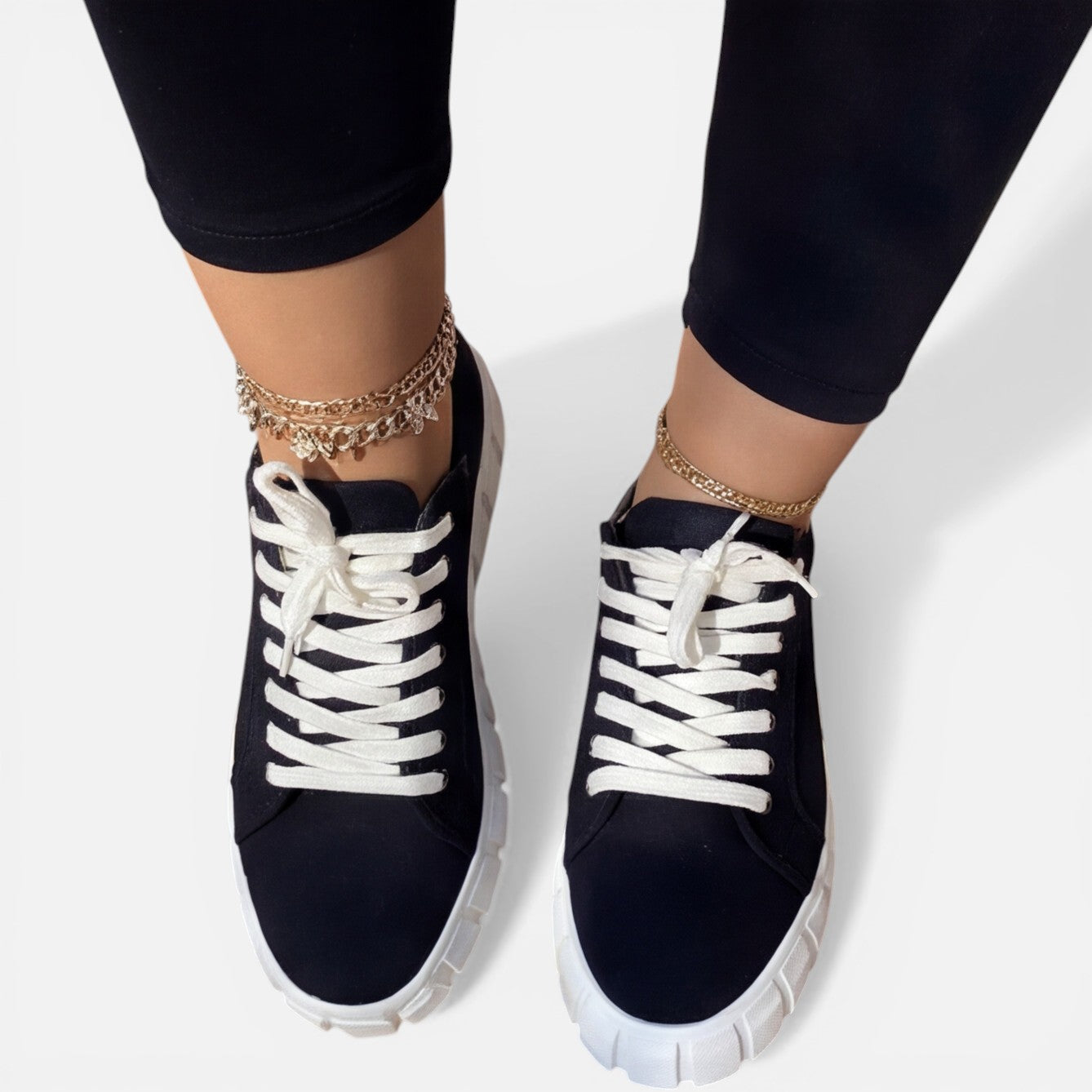 Felorro women's black sneakers with white laces and chunky white tread sole
