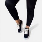 Felorro women's black sneakers with white laces and thick light sole, side view