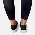Felorro women's black sneakers with white laces and thick sole, rear view