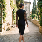 Black lace cocktail dress back view with sheer lace sleeves and straight pencil hem