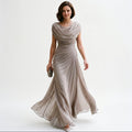 Taupe maxi dress with draped cowl neckline and gathered waist, flowing skirt.