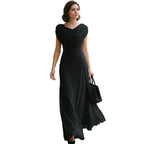 Black maxi dress with draped cowl neckline and gathered waist, flared hem.