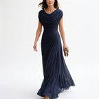 Navy maxi dress with draped cowl neckline and gathered waist, ankle-length skirt.